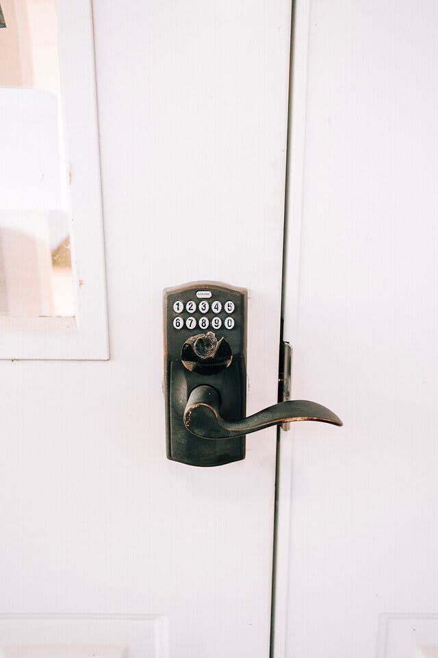 A door equipped with a modern keypad lock for enhanced security.