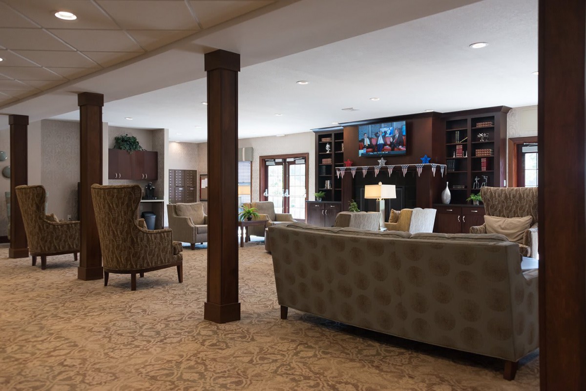 Spacious lobby with comfortable seating and a television.