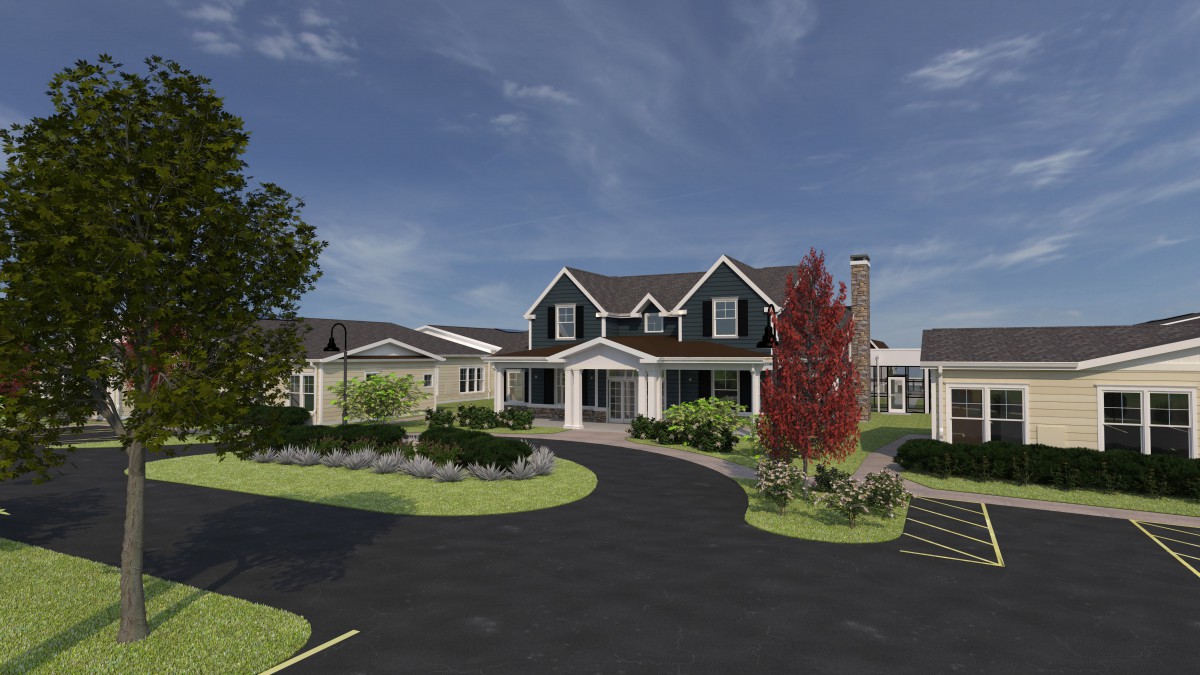 A suburban house with a curved driveway and well-maintained landscaping.
