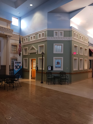 An interior view showcasing a decorative building facade in a public space.