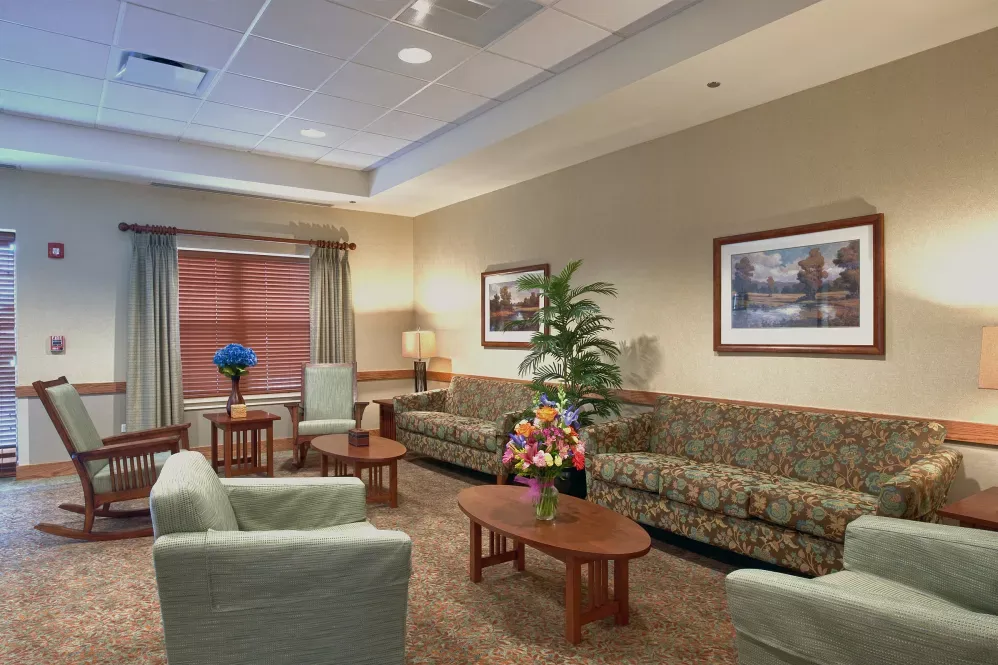 A cozy lobby or waiting room with comfortable seating and neutral decor.