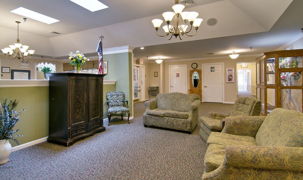 A spacious living room with comfortable seating and elegant decor.