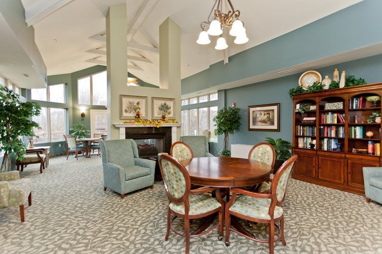 A well-appointed living room with a cozy seating area, fireplace, and elegant furniture.