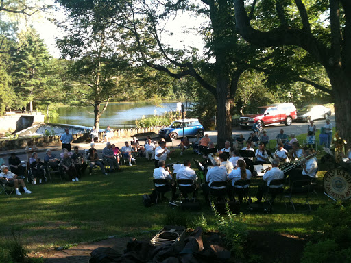 A lively outdoor gathering surrounded by nature.
