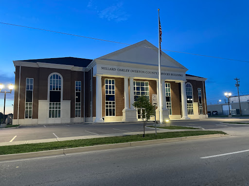 A well-lit architectural building captured during dusk.