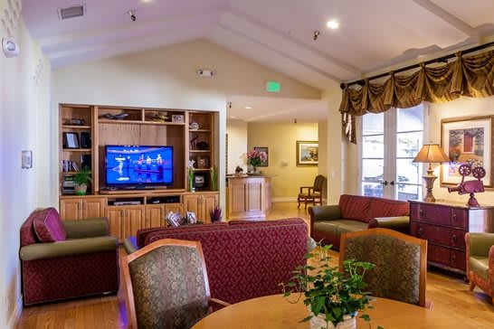 A cozy living room with comfortable seating and a television.
