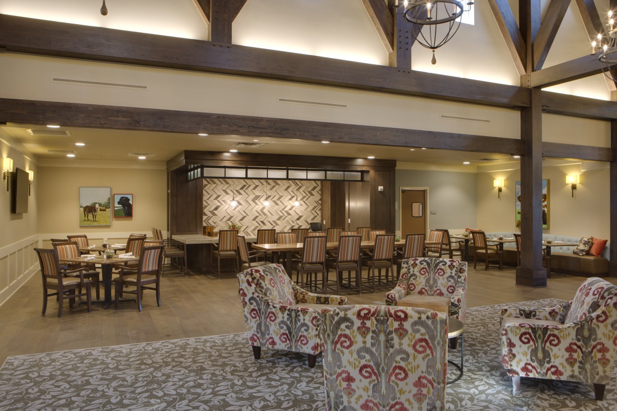 A spacious and elegantly decorated lounge with comfortable seating.