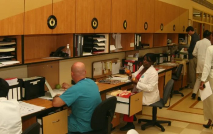 People working at desks in an office setting.