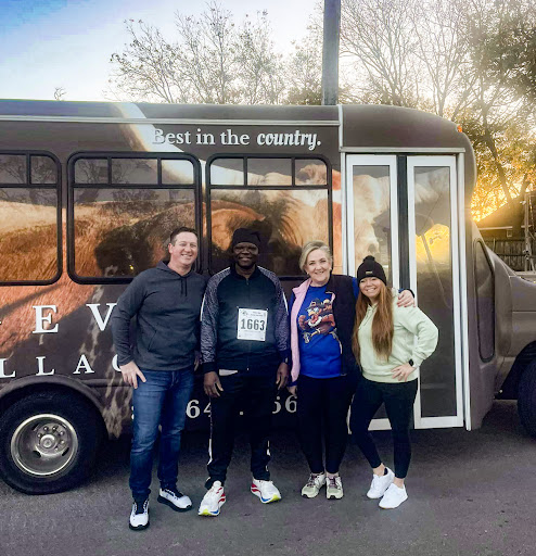 A fun day out with friends in front of a bus!