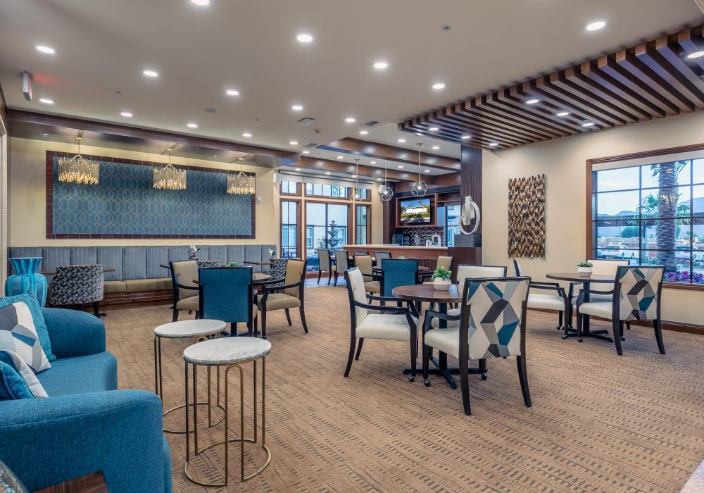 A modern lounge area featuring stylish furniture and ambient lighting.