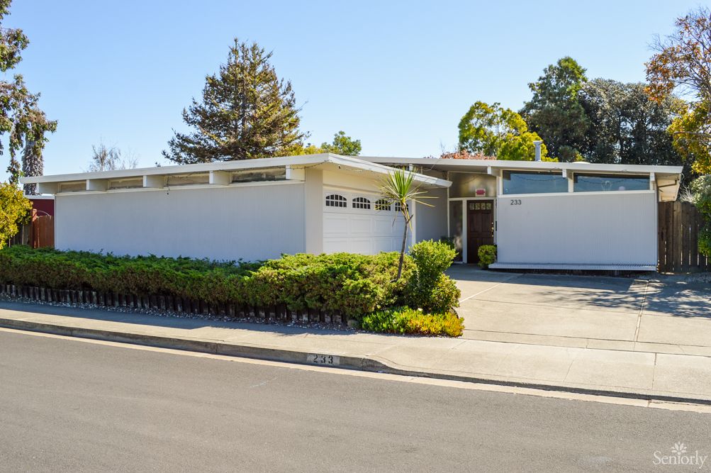 Mid-century modern house with a landscaped front yard.