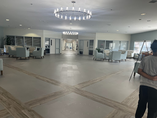 A spacious and modern lobby with elegant lighting and comfortable seating areas.