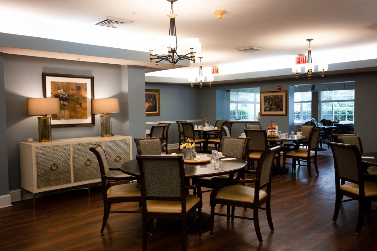 A well-appointed dining room with elegant furnishings and ambient lighting.