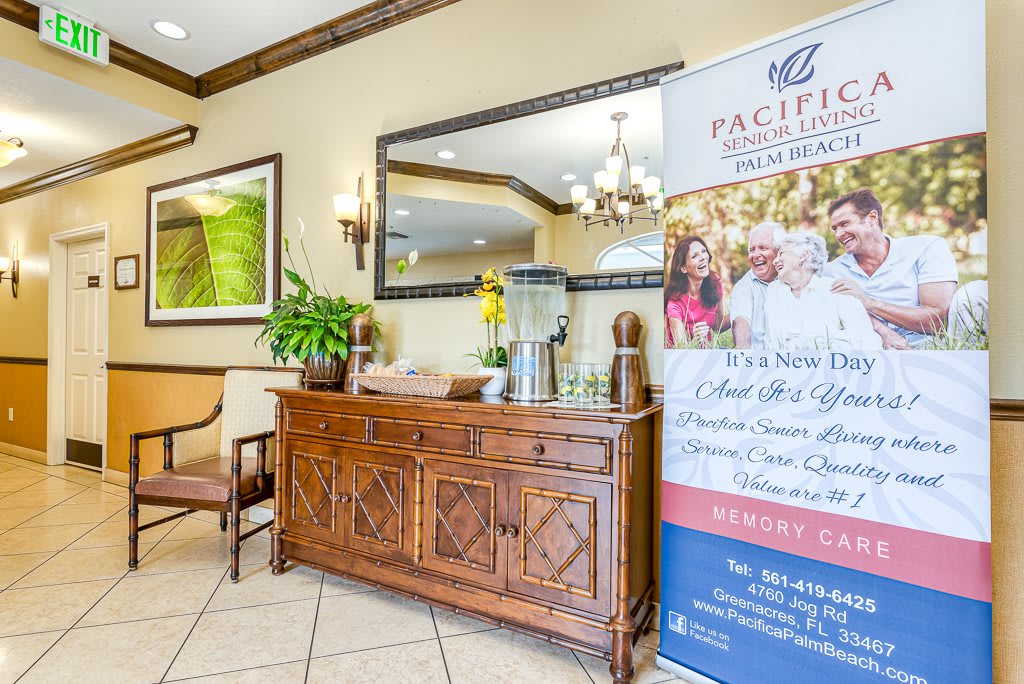 A welcoming reception area with elegant furniture and a promotional banner.