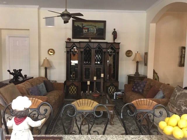 A cozy living room with comfortable seating and elegant decor.