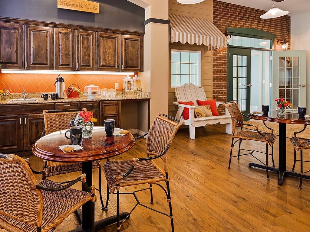 A cozy kitchen and dining area featuring rustic dcor and a coffee station.