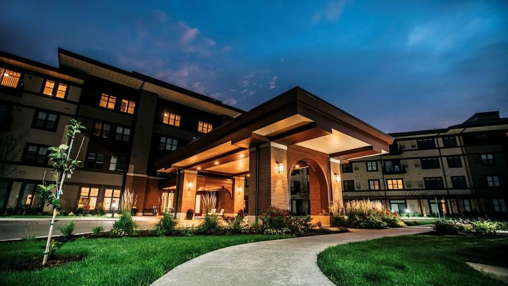 Illuminated building entrance at night.