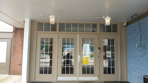 A welcoming entrance featuring double doors and decorative lanterns.