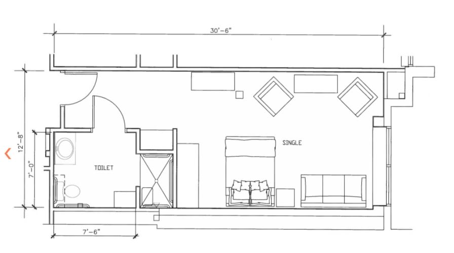 A detailed floor plan of a room showcasing furniture arrangement and dimensions.