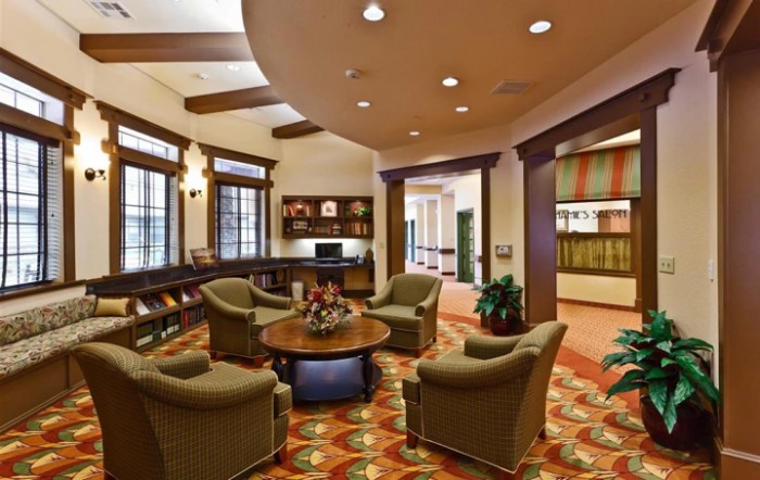 A cozy library interior with comfortable seating and bookshelves.