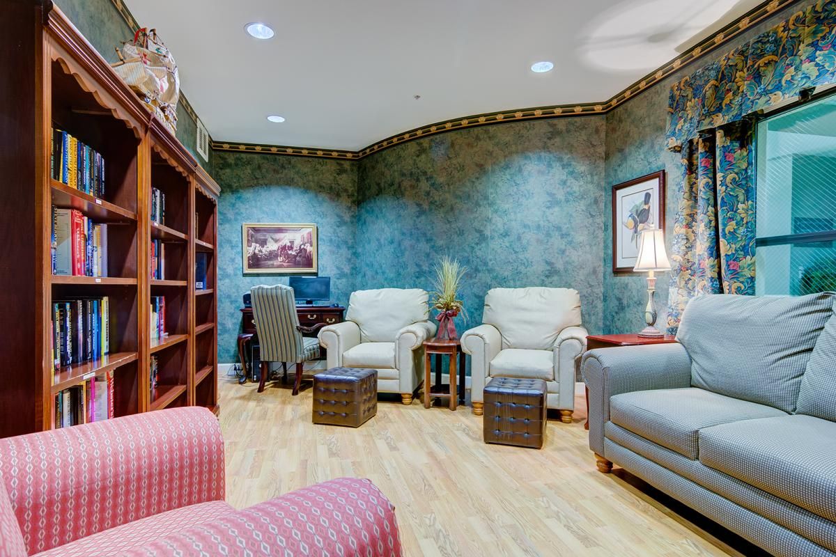 A cozy office space with comfortable seating and a desk area.