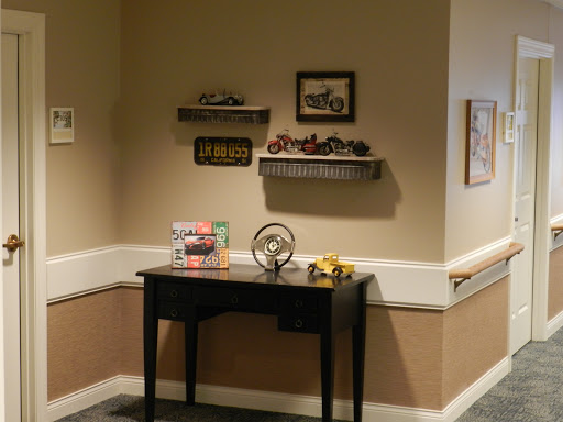 A cozy corner showcasing vintage decor with shelves and a stylish black table.