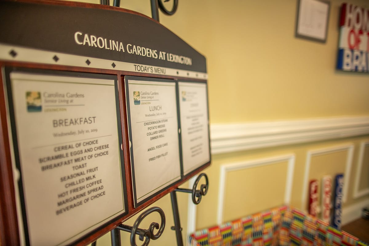A display board showcasing the menu at Carolina Gardens.