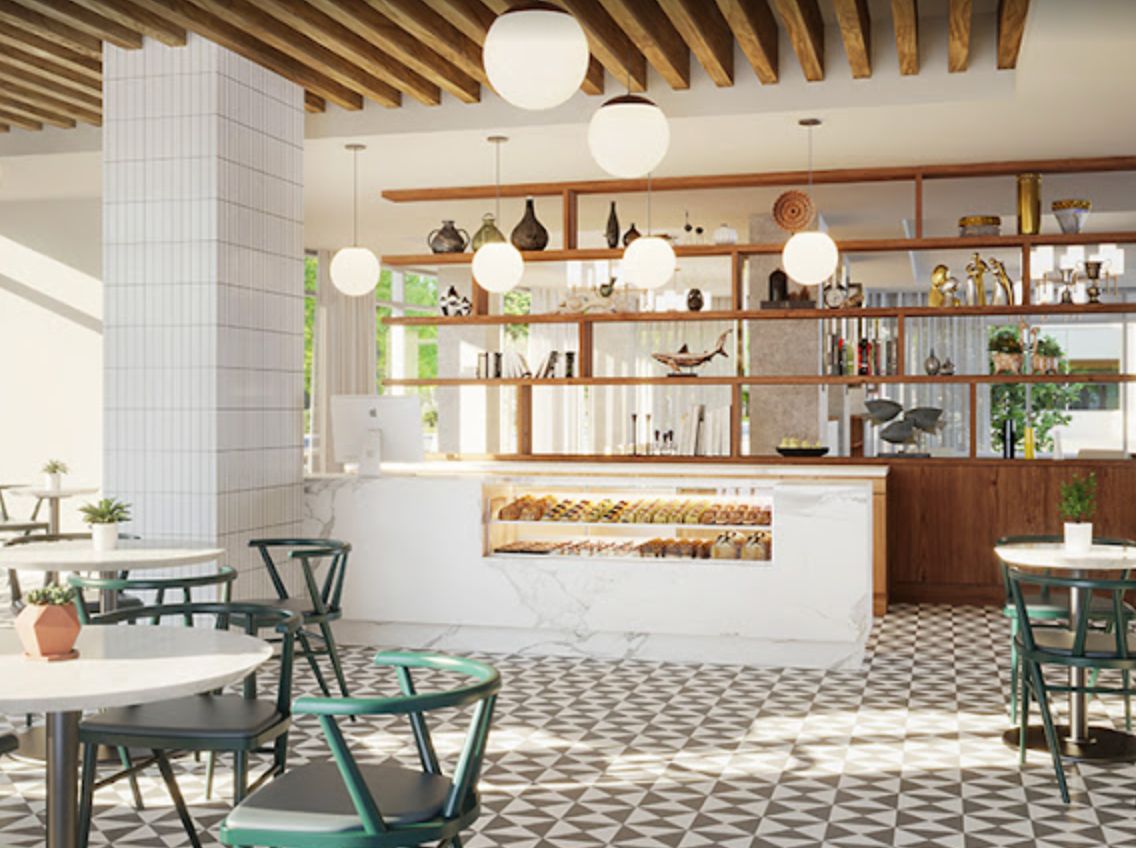 A modern cafe interior with stylish lighting and geometric floor tiles.