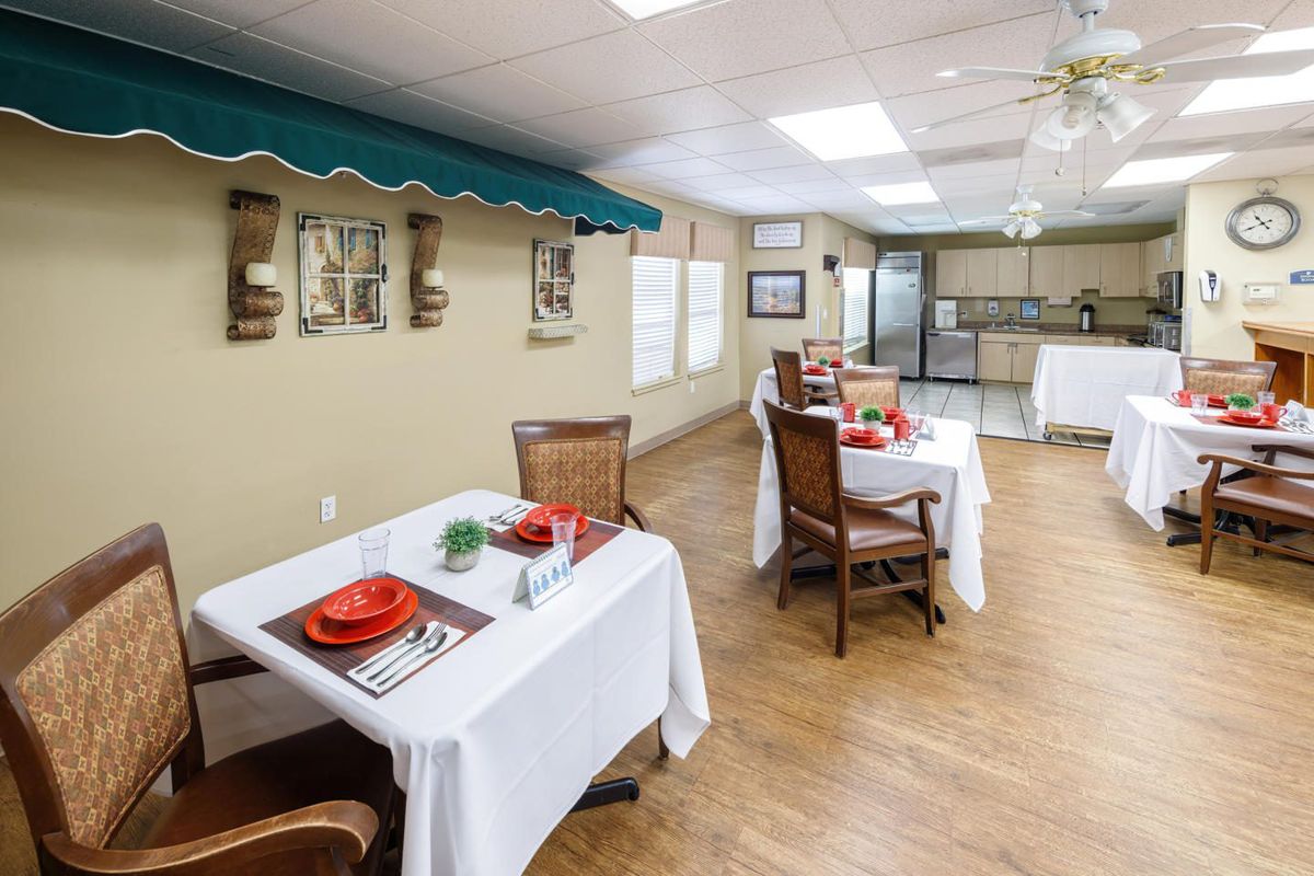 A cozy dining area with elegantly set tables and stylish decor.