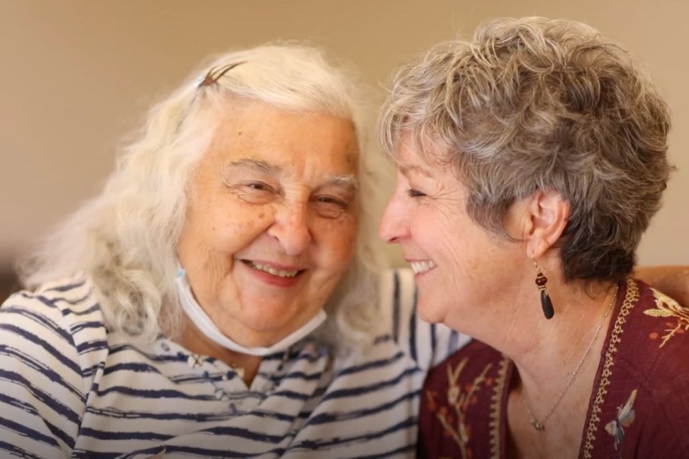 Two women sharing a joyful moment together.