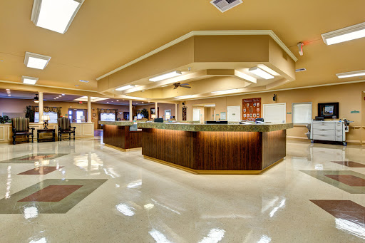 A modern and inviting lobby area featuring a sleek reception desk and polished marble flooring.