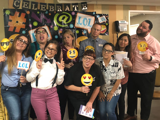 A joyful celebration with friends, showcasing fun emoji props and lots of smiles!