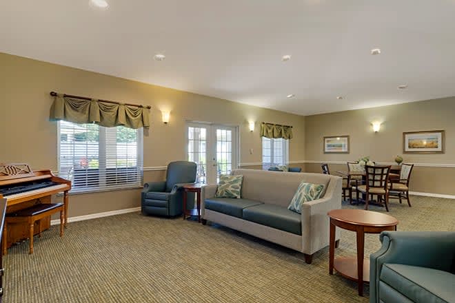 A cozy living room with comfortable seating and ample natural light.