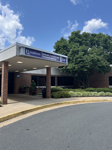 The entrance of a healthcare facility on a bright sunny day.