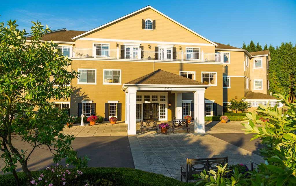 A well-maintained residential building with a welcoming entrance and landscaped surroundings.