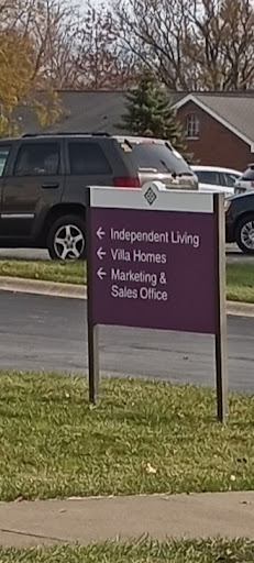 Directional sign indicating the locations of Independent Living, Villa Homes, and the Management & Sales Office.