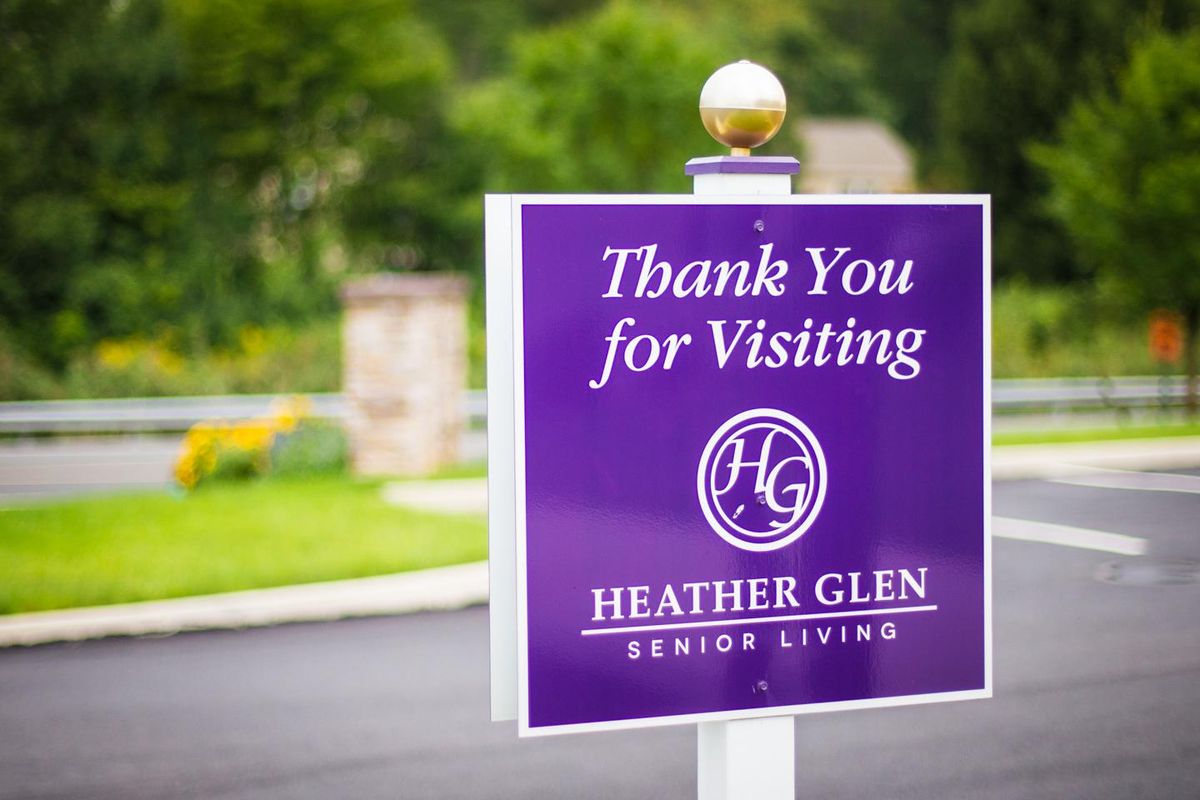 A purple sign thanking visitors at Heather Glen Senior Living.