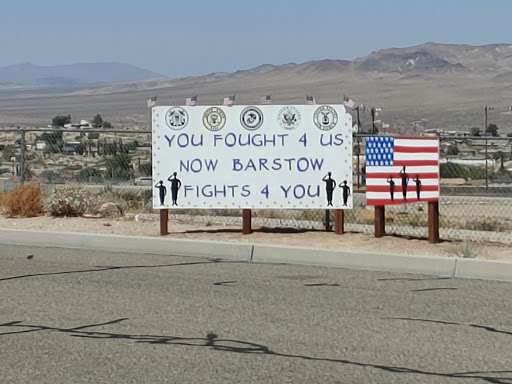 A sign expressing support from Barstow, featuring an American flag.