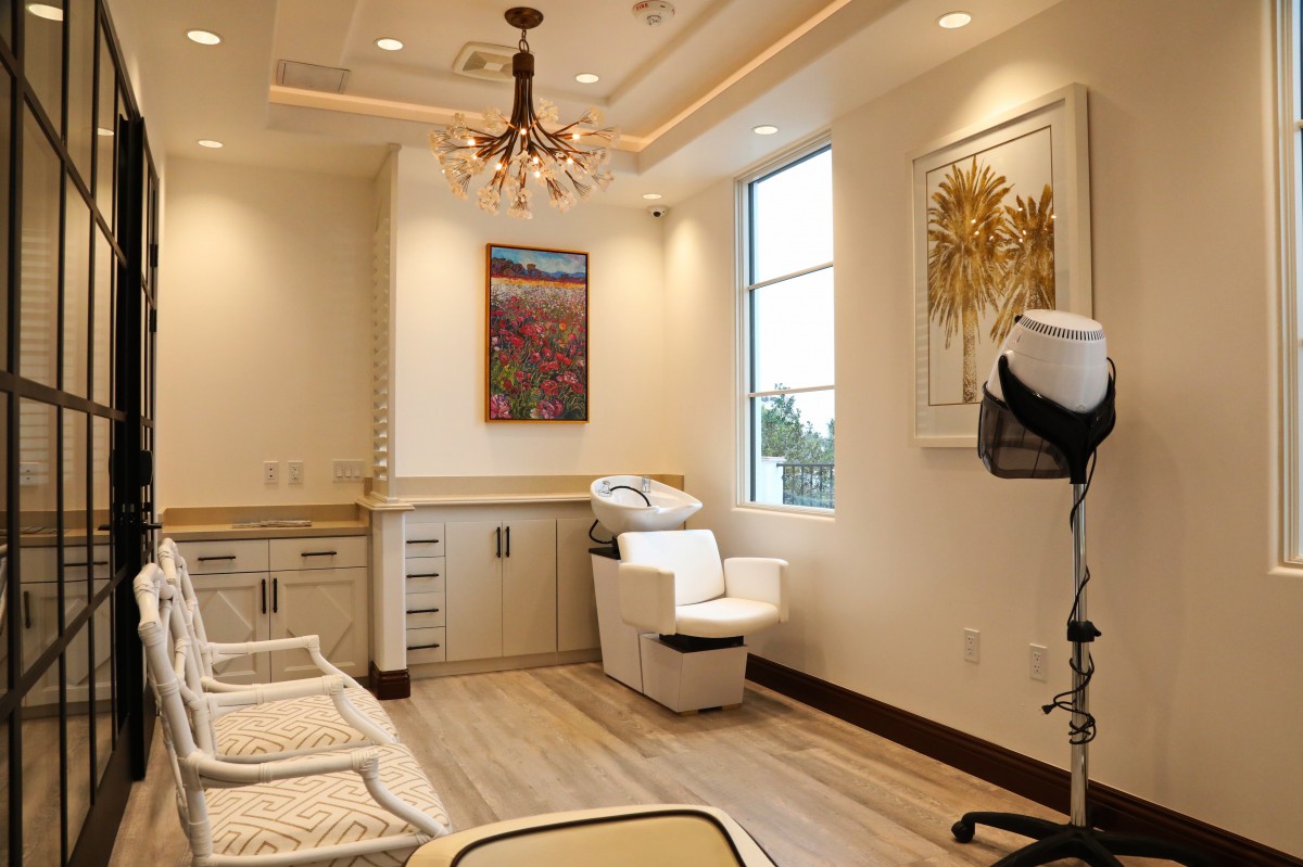 A luxurious spa room featuring elegant furnishings and modern decor.