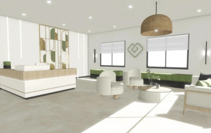 A modern and minimalist waiting room with stylish furniture and ample natural lighting.
