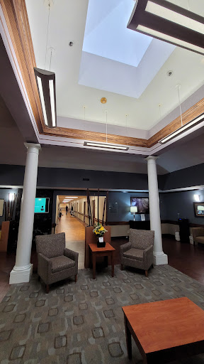 A modern lobby area featuring comfortable seating and stylish design elements.