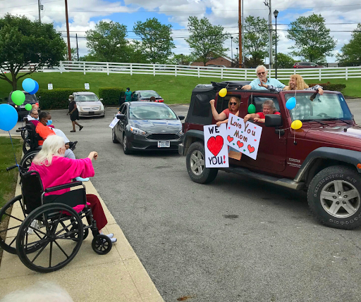A joyful community parade filled with love and support, featuring colorful signs, balloons, and happy participants.