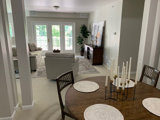 A beautifully designed open living and dining space featuring modern furniture and natural light.