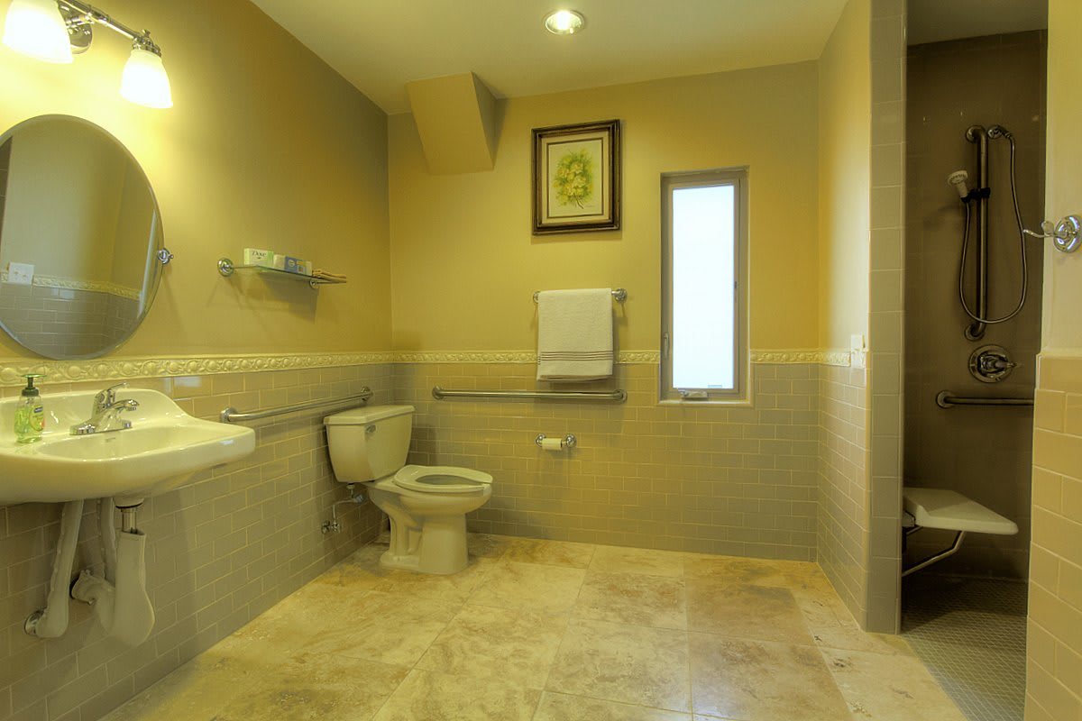 A spacious and accessible bathroom with modern amenities.