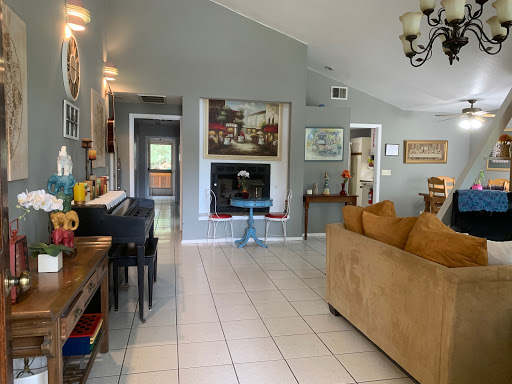 A spacious and inviting living room featuring a contemporary design with modern furniture and decorative elements.