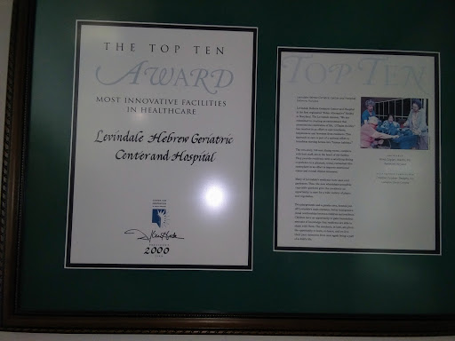 A framed award certificate recognizing outstanding achievement.