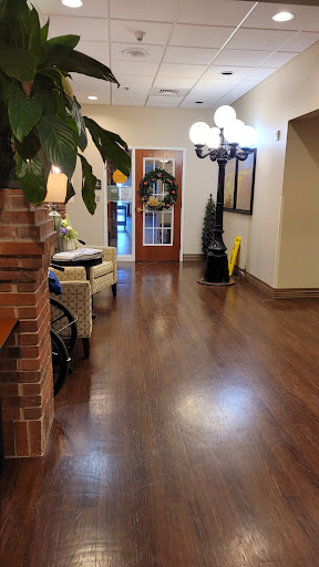 A welcoming lobby area with stylish decor and wooden flooring.