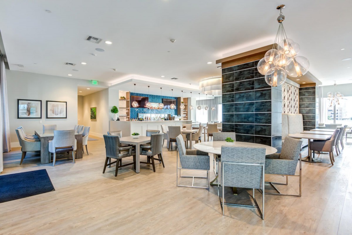 A modern lounge area with seating and ambient lighting.