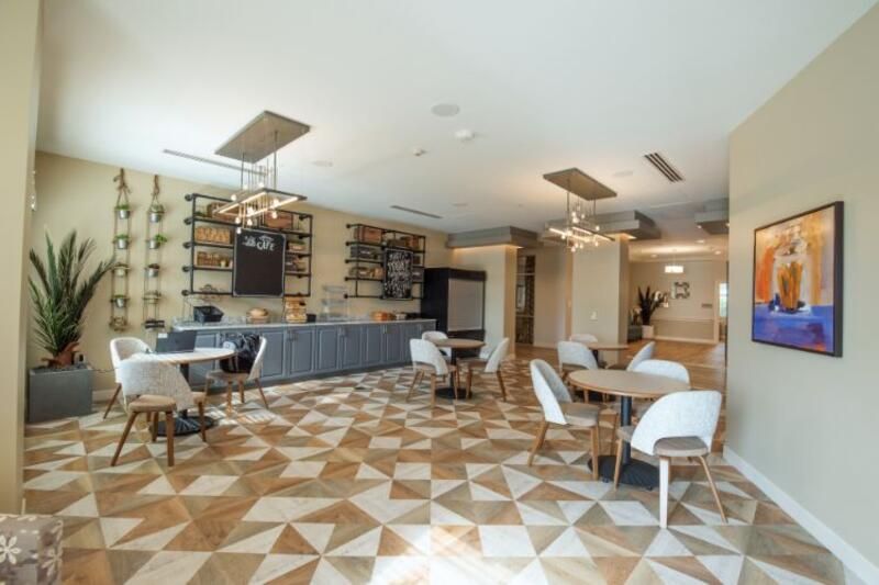 A modern dining area with contemporary furniture and elegant lighting.