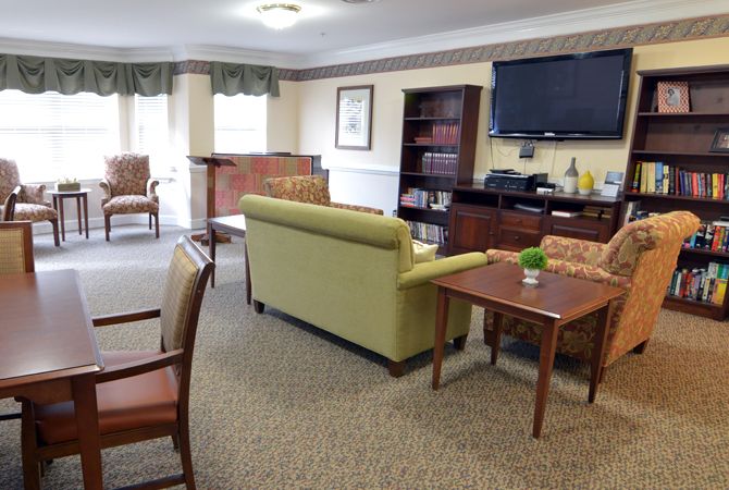 A cozy living room with comfortable seating and a television.